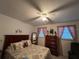 Bright bedroom with ample closet space and dresser at 5030 Haywood Ruffin Rd, St Cloud, FL 34771