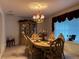 Elegant dining room with a formal table and chandelier at 5030 Haywood Ruffin Rd, St Cloud, FL 34771