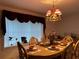Elegant dining room, featuring a formal table setting at 5030 Haywood Ruffin Rd, St Cloud, FL 34771