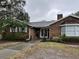 Brick home with mature landscaping and a walkway to the entrance at 5030 Haywood Ruffin Rd, St Cloud, FL 34771