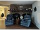 Brick fireplace with a mantel decorated with Gathering photos at 5030 Haywood Ruffin Rd, St Cloud, FL 34771