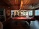 Game room with a pool table, wood accents, and a view to the outside at 5030 Haywood Ruffin Rd, St Cloud, FL 34771