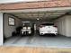 Two-car garage with golf cart and additional storage at 5030 Haywood Ruffin Rd, St Cloud, FL 34771