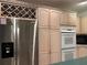 Modern kitchen with stainless steel refrigerator and built-in oven at 5030 Haywood Ruffin Rd, St Cloud, FL 34771
