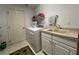 Convenient laundry room with washer, dryer, and extra storage at 5030 Haywood Ruffin Rd, St Cloud, FL 34771