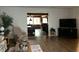 Living room with a view of a sunroom with a pool table at 5030 Haywood Ruffin Rd, St Cloud, FL 34771