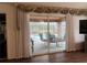 Living room with sliding doors leading to the pool area at 5030 Haywood Ruffin Rd, St Cloud, FL 34771