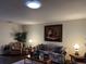 Bright living room featuring comfy seating and large artwork at 5030 Haywood Ruffin Rd, St Cloud, FL 34771