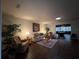 Spacious living room with hardwood floors and comfy furniture at 5030 Haywood Ruffin Rd, St Cloud, FL 34771