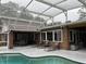 Spacious pool area with lounge chairs and dining furniture at 5030 Haywood Ruffin Rd, St Cloud, FL 34771