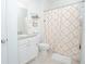 Second bathroom with shower/tub and patterned curtain at 5283 Bracks Landing Dr Dr, St Cloud, FL 34771