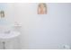 Simple, clean bathroom with pedestal sink and oval mirror at 5283 Bracks Landing Dr Dr, St Cloud, FL 34771