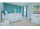 Guest bedroom with teal accent wall and full bed at 5283 Bracks Landing Dr Dr, St Cloud, FL 34771