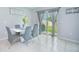 Dining area with gray chairs and sliding glass doors at 5283 Bracks Landing Dr Dr, St Cloud, FL 34771