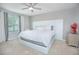Bright main bedroom with large bed and tufted headboard at 5283 Bracks Landing Dr Dr, St Cloud, FL 34771