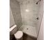 Shower stall with marble-look tile and gray floor at 5920 Nw 65Th St, Ocala, FL 34482