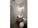 Clean bathroom with white vanity, toilet, and gray floor at 5920 Nw 65Th St, Ocala, FL 34482