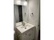 Modern bathroom with white vanity and brushed nickel fixtures at 5920 Nw 65Th St, Ocala, FL 34482