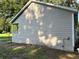 Side view of house showcasing tan siding and small porch at 5920 Nw 65Th St, Ocala, FL 34482