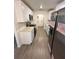 Modern kitchen with white cabinets and stainless steel appliances at 5920 Nw 65Th St, Ocala, FL 34482