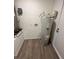 Laundry room with water heater and access to exterior at 5920 Nw 65Th St, Ocala, FL 34482