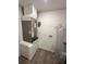 Laundry room with washer, dryer hookups, water heater, and HVAC unit at 5920 Nw 65Th St, Ocala, FL 34482