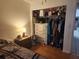 Bedroom with hardwood floors and an open closet at 602 Caddy Dr, Kissimmee, FL 34759