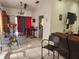 Inviting living and dining area with tile flooring, neutral tones, and an open, airy layout at 602 Caddy Dr, Kissimmee, FL 34759