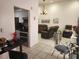 Bright, open-concept living space with tile flooring, neutral paint, and a seamless transition to the kitchen at 602 Caddy Dr, Kissimmee, FL 34759
