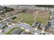 Aerial view of a residential neighborhood with a playground at 606 Tortugas St, Haines City, FL 33844