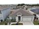 Aerial view of a house and surrounding neighborhood at 606 Tortugas St, Haines City, FL 33844