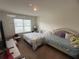 Spacious bedroom with two beds and large window at 606 Tortugas St, Haines City, FL 33844