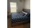 Bedroom with a king-size bed and window at 606 Tortugas St, Haines City, FL 33844