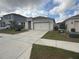 Single story house with a two car garage at 606 Tortugas St, Haines City, FL 33844