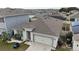 Aerial view of a single-Gathering home with a two-car garage at 606 Tortugas St, Haines City, FL 33844