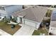 Aerial view of a single-Gathering home with a two-car garage at 606 Tortugas St, Haines City, FL 33844