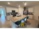 Kitchen with island, granite countertops, and stainless steel appliances at 606 Tortugas St, Haines City, FL 33844