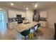 Kitchen with island, granite countertops, and stainless steel appliances at 606 Tortugas St, Haines City, FL 33844