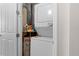 Small laundry room with washer, dryer, and water heater at 619 Founders Dr, Kissimmee, FL 34744