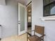 Cozy balcony featuring a lone chair and a view into the primary bedroom at 733 Desert Mountain Ct, Reunion, FL 34747