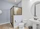Bathroom featuring a glass-enclosed shower, modern fixtures, and neutral tones at 733 Desert Mountain Ct, Reunion, FL 34747