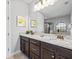Bathroom features a granite countertop, double vanity, and tile flooring at 733 Desert Mountain Ct, Reunion, FL 34747