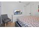 Cozy bedroom features a comfortable bed, soft chair, and a TV at 733 Desert Mountain Ct, Reunion, FL 34747