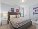 This bedroom features a comfortable bed, soft decor, and is decorated with sports memorabilia at 733 Desert Mountain Ct, Reunion, FL 34747