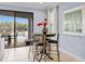 Cozy breakfast nook with a view of the outdoor pool area and backyard at 733 Desert Mountain Ct, Reunion, FL 34747