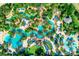 A large pool area with an abundance of umbrellas and lounge chairs at 733 Desert Mountain Ct, Reunion, FL 34747
