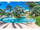 Enjoy swimming in this gorgeous pool with lush landscaping and a waterfall feature at 733 Desert Mountain Ct, Reunion, FL 34747