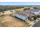Two-story homes with golf course in the background with a pool at 733 Desert Mountain Ct, Reunion, FL 34747