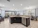 Modern kitchen featuring granite countertops, stainless steel appliances, and an open floor plan at 733 Desert Mountain Ct, Reunion, FL 34747