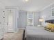 Inviting main bedroom featuring carpet floor, balcony access, and neutral decor at 733 Desert Mountain Ct, Reunion, FL 34747